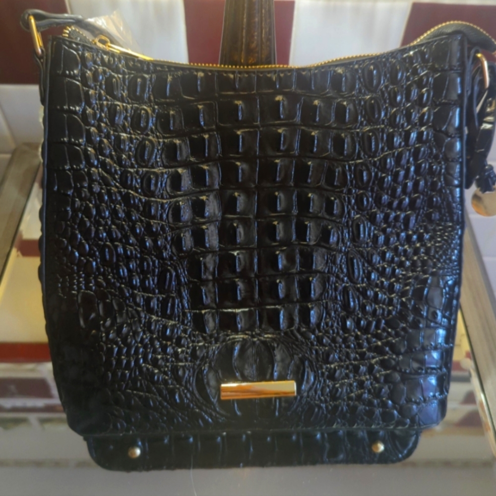 New without tags. Black crossbody crocodile print purse never used sealed straps